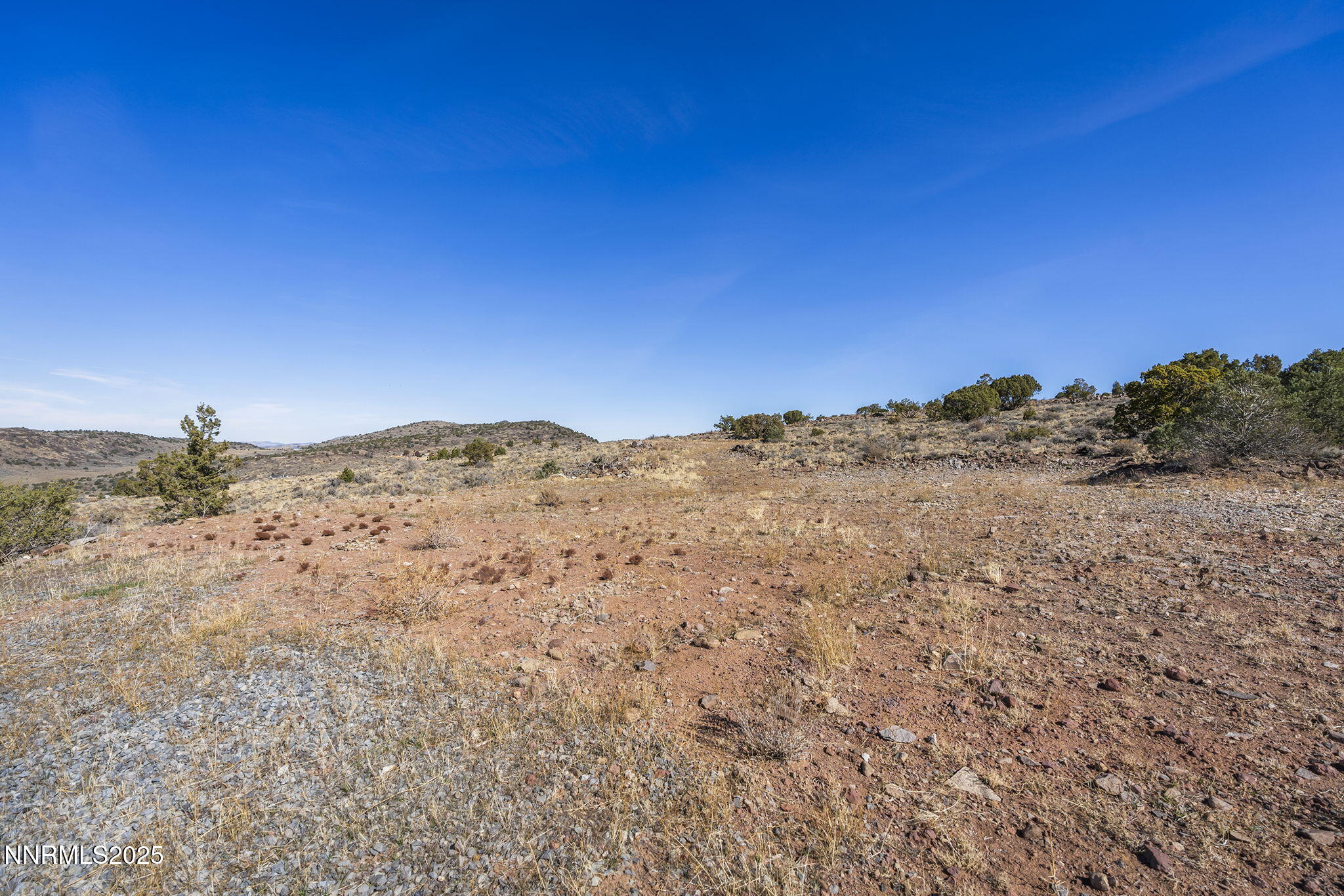 3790 Bullfrog Road Reno, NV 89521 - Photo 6 of 17 a view of a large mountain with mountains in the background