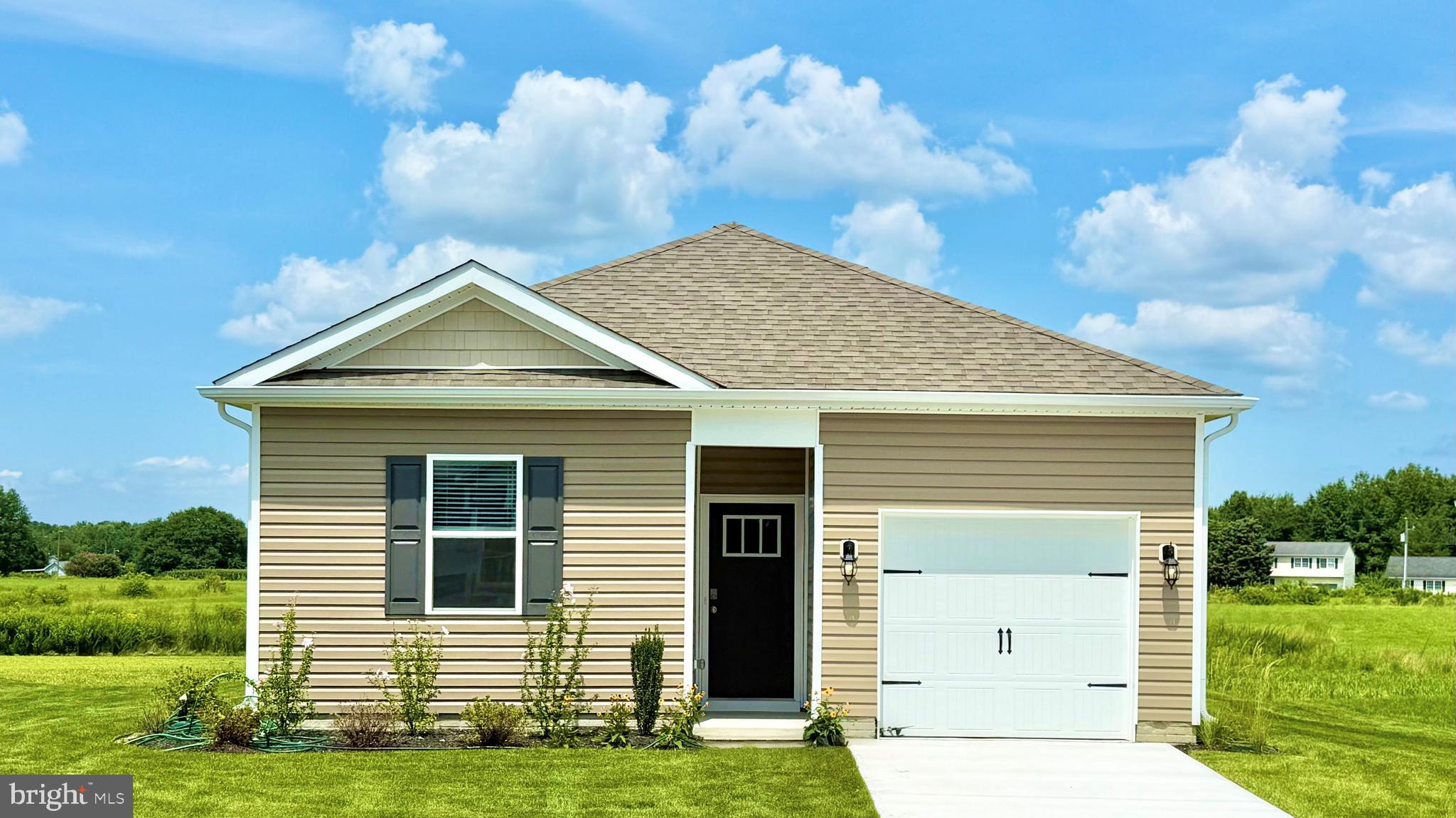 119 Parkland Road Greensboro, MD 21639 - Photo 1 of 3 a view of a house with a yard