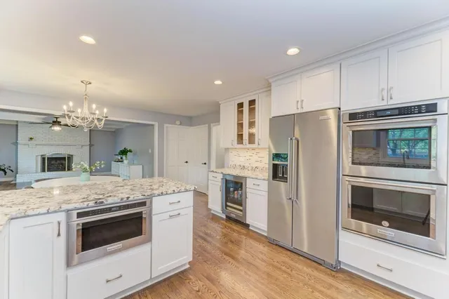 a kitchen with a sink stove and refrigerator
