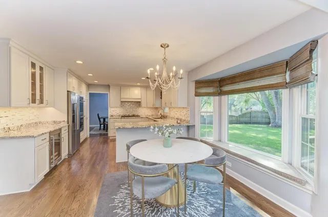 a kitchen with stainless steel appliances granite countertop a sink and stove