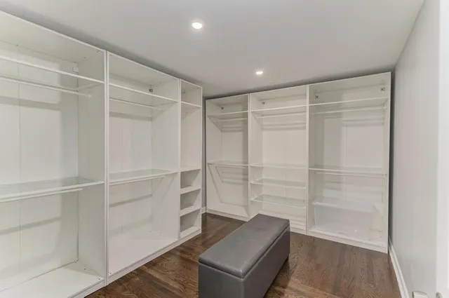 a view of an empty walk in closet