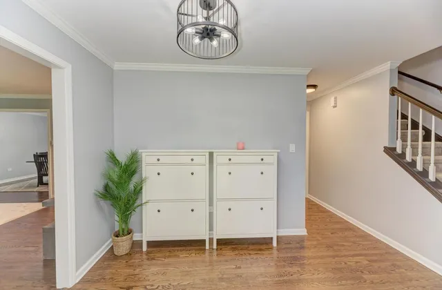 a view of an entryway with wooden floor