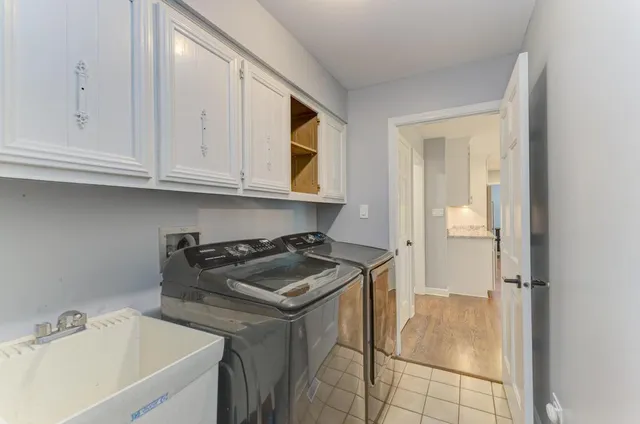 a kitchen with a sink and cabinets