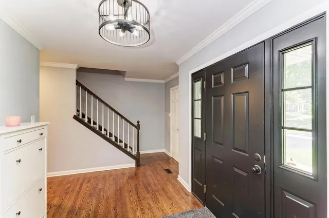 a view of entryway with wooden floor