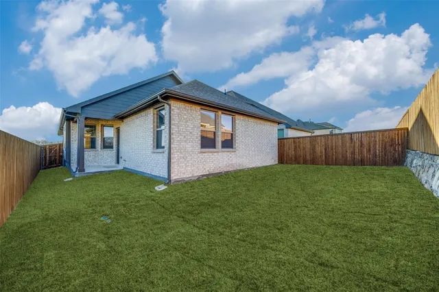 a bathroom with a sink a toilet and a window
