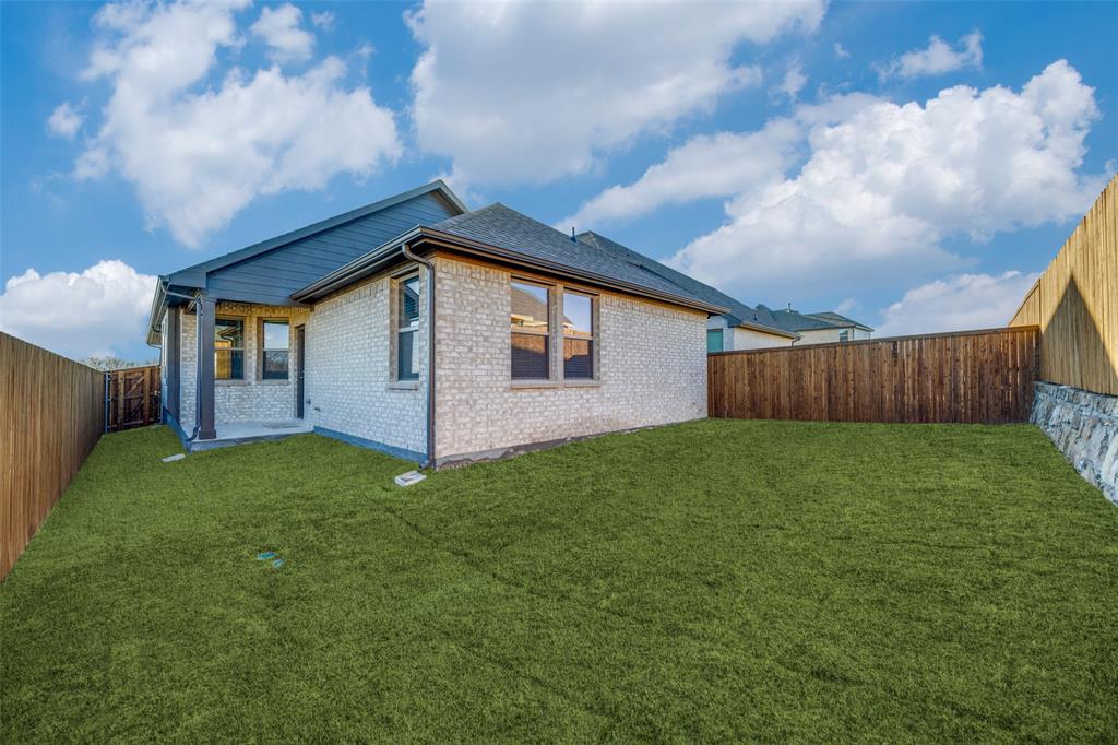 3728 Aqua Lane Sherman, TX 75090 - Photo 11 of 12 a backyard of a house with lots of green space