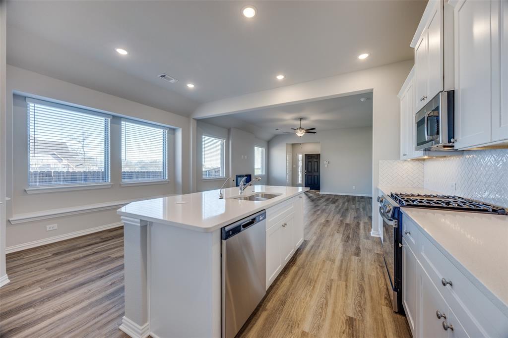 3728 Aqua Lane Sherman, TX 75090 - Photo 12 of 12 a kitchen with a sink stove and cabinets