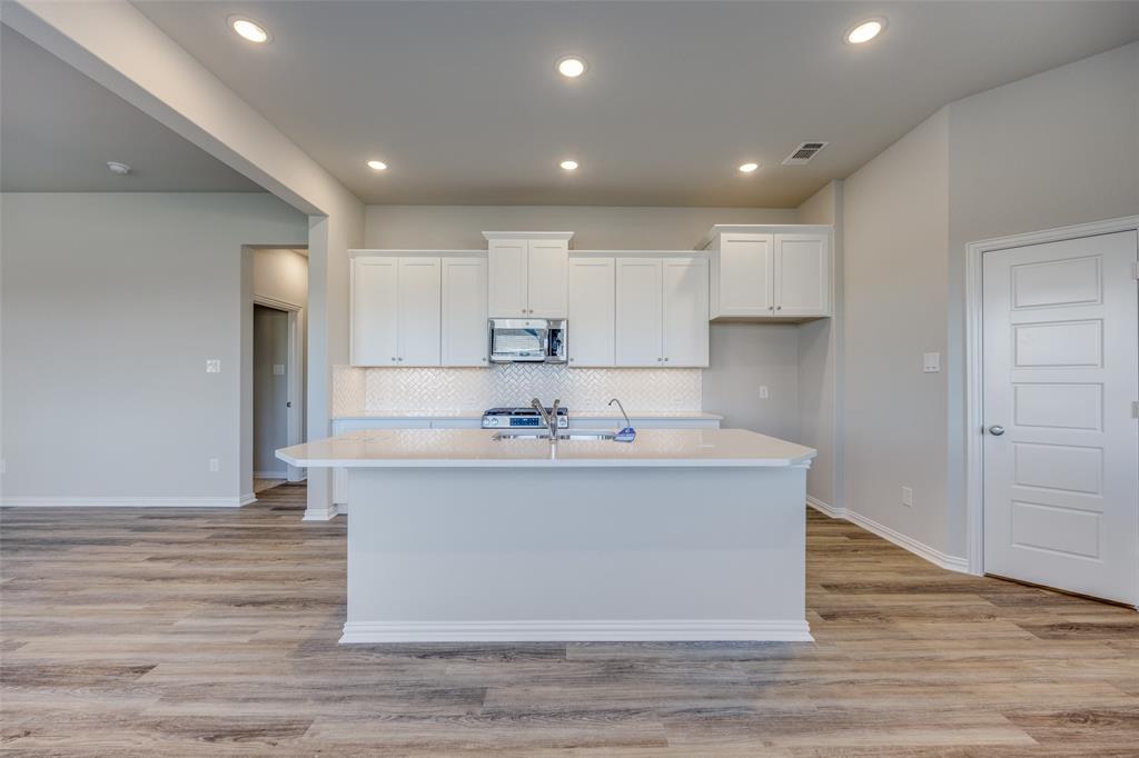 3728 Aqua Lane Sherman, TX 75090 - Photo 4 of 12 a view of kitchen with stainless steel appliances refrigerator sink and cabinets
