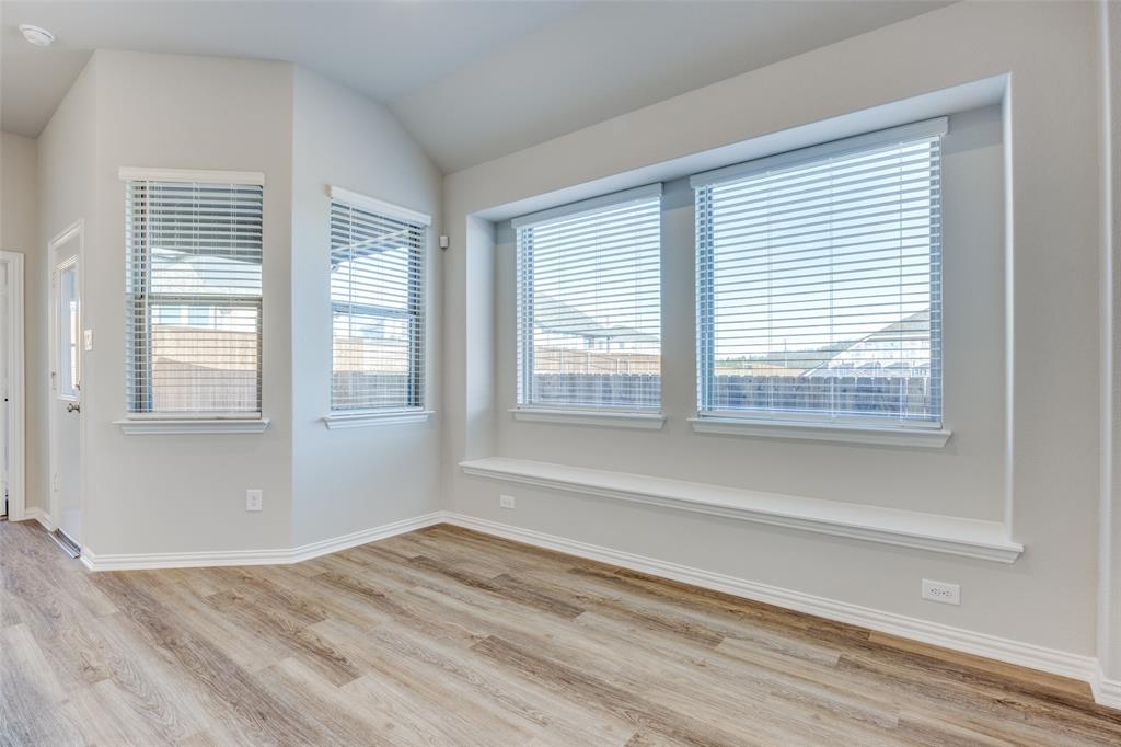 3728 Aqua Lane Sherman, TX 75090 - Photo 5 of 12 a view of an empty room with wooden floor and a window