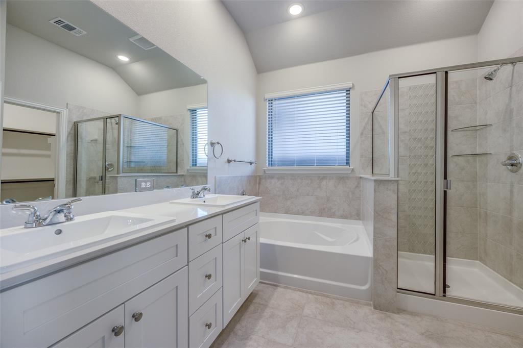 3728 Aqua Lane Sherman, TX 75090 - Photo 7 of 12 a bathroom with a tub sink and mirror