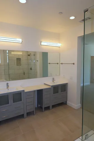 a bathroom with a shower and a sink