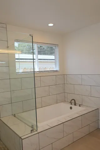 a bathroom with a toilet and shower
