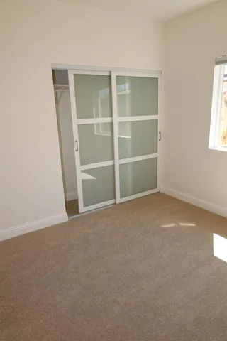 a view of balcony with wooden floor