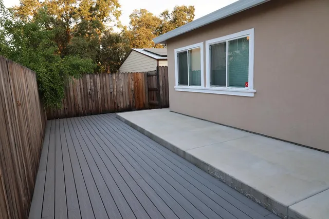 a view of balcony with wooden floor
