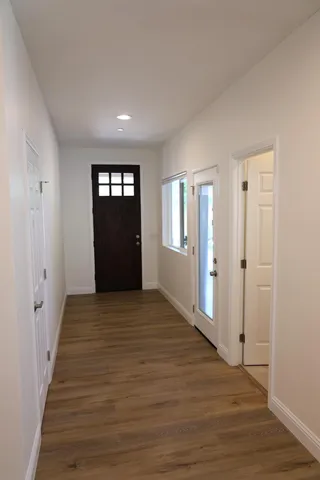 wooden floor in an empty room with window