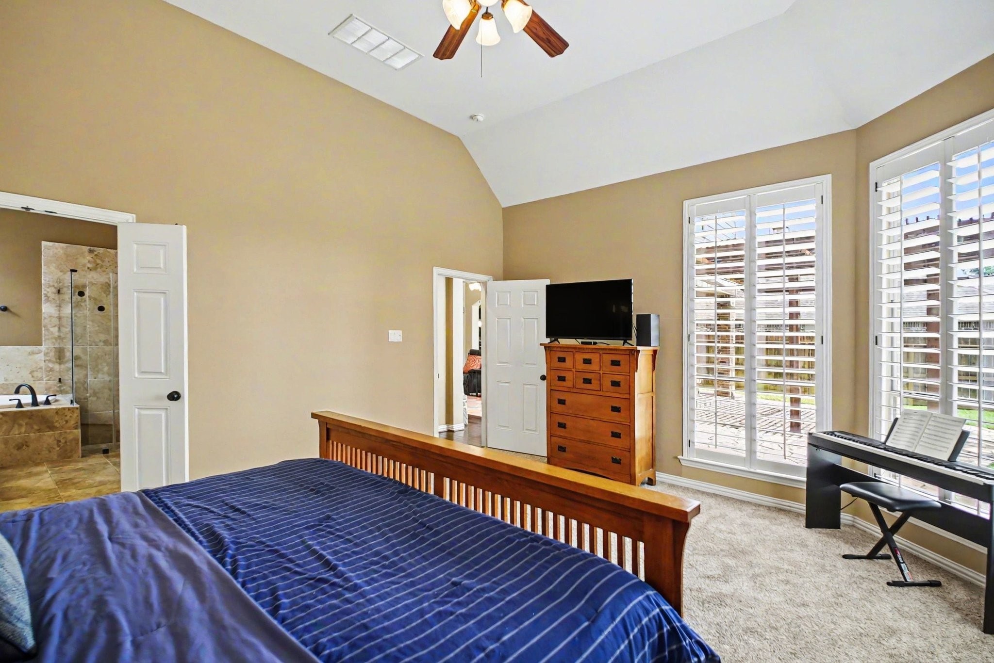 8210 Thunder Ridge Way Missouri City, TX 77459 - Photo 24 of 42 Spacious primary bedroom with convenient hallway access from the den.