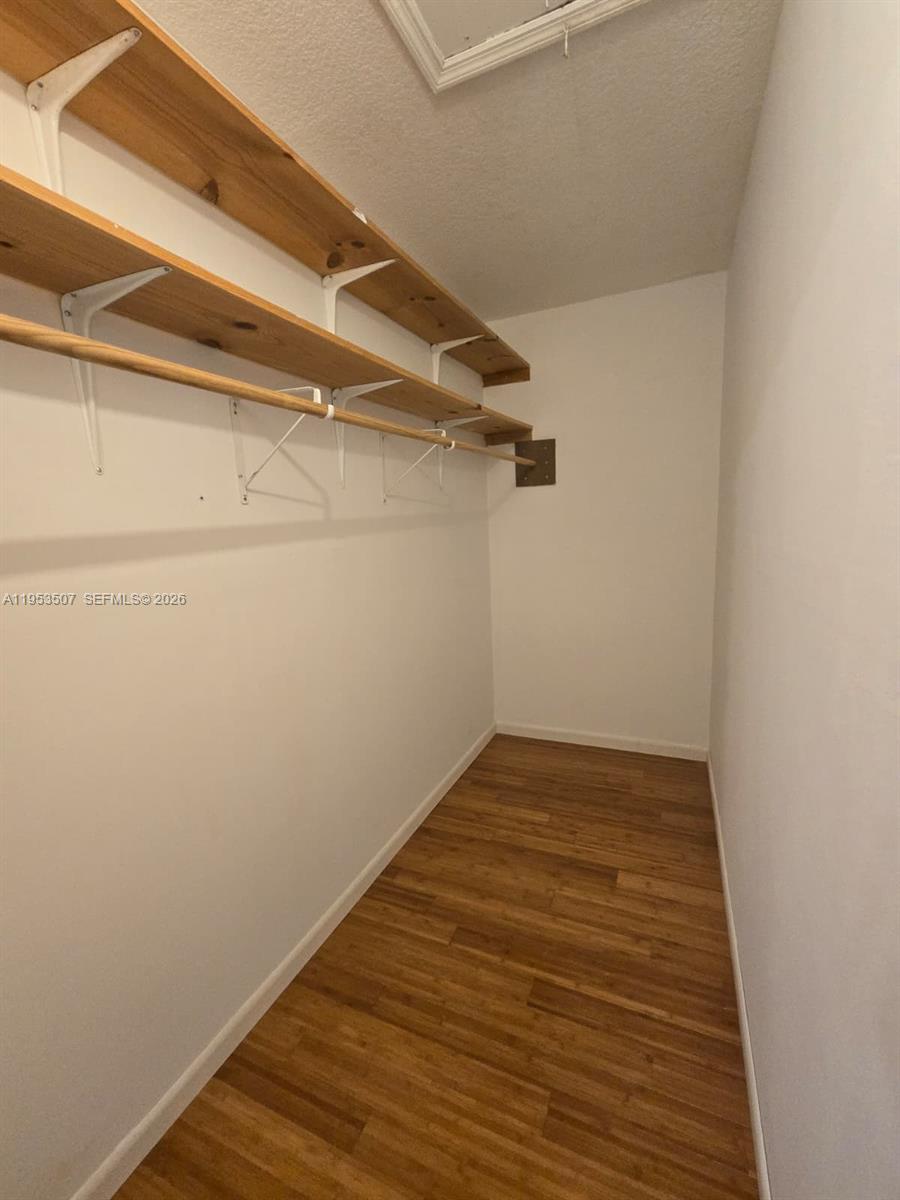 8394 Southwest 152nd Avenue, Unit 35 Miami, FL 33193 - Photo 14 of 24 a view of a small space with wooden floor