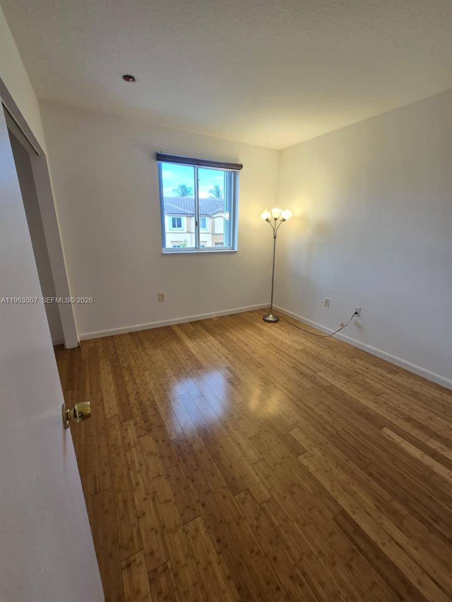 8394 Southwest 152nd Avenue, Unit 35 Miami, FL 33193 - Photo 16 of 24 an empty room with windows