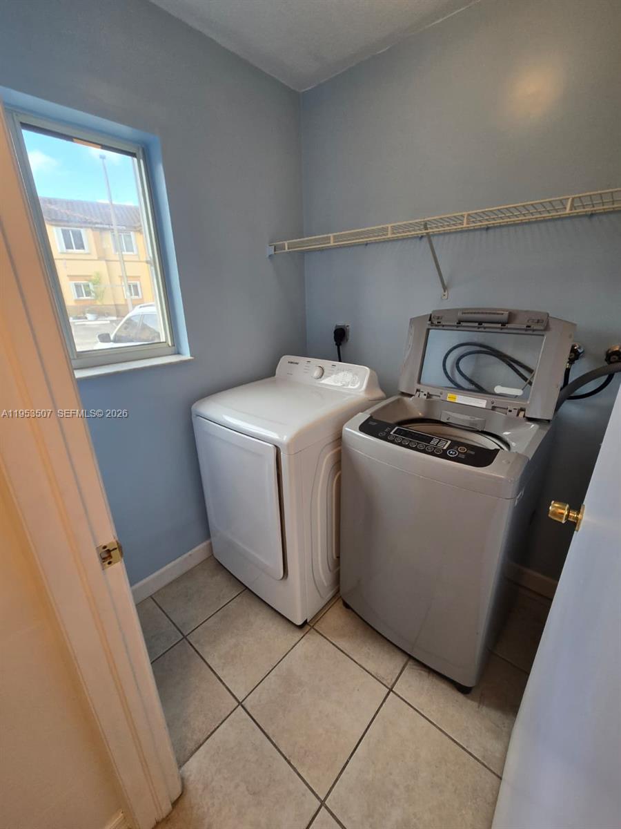 8394 Southwest 152nd Avenue, Unit 35 Miami, FL 33193 - Photo 22 of 24 a utility room with dryer and washer