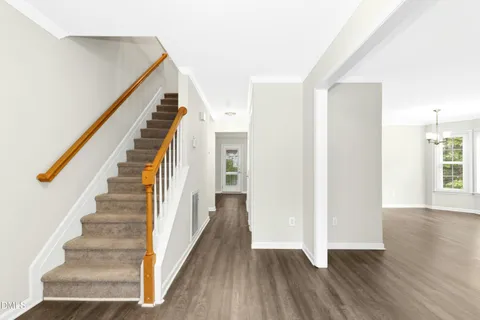a view of an entryway with wooden floor