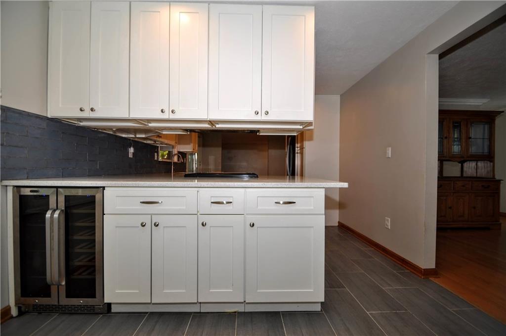 603 Meade Drive Coraopolis, PA 15108 - Photo 12 of 41 a kitchen with stainless steel appliances granite countertop a sink and a microwave