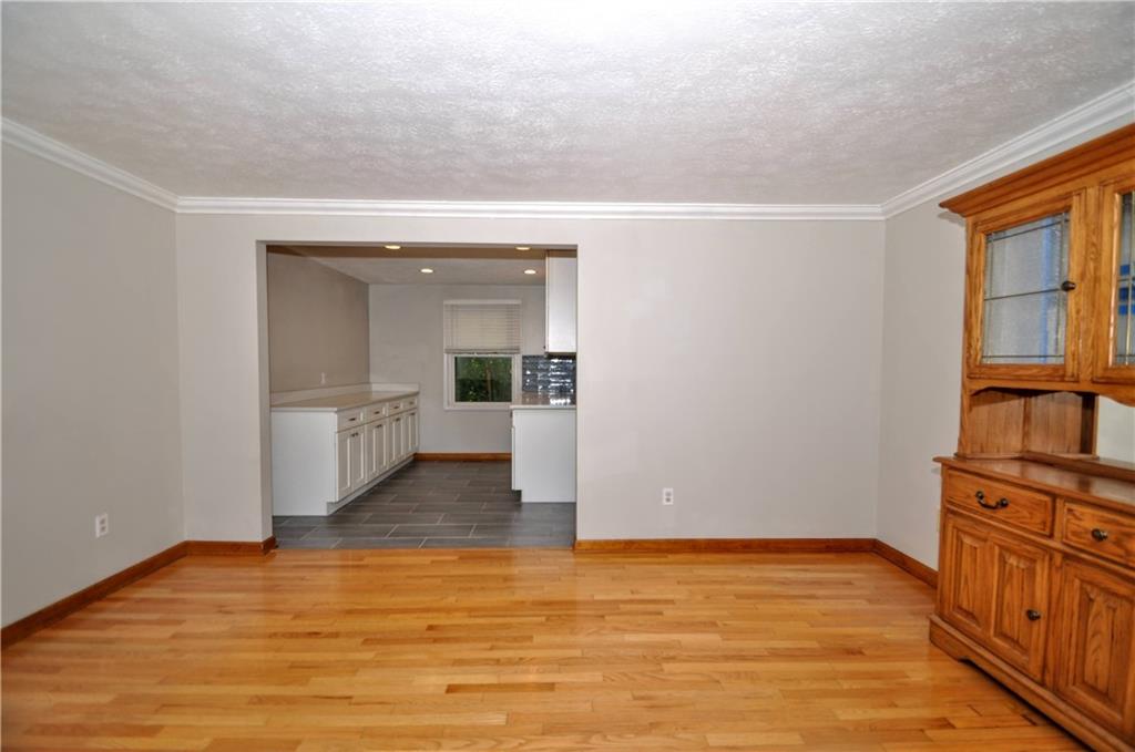 603 Meade Drive Coraopolis, PA 15108 - Photo 17 of 41 a view of an empty room with wooden floor and a window
