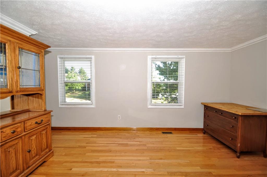 603 Meade Drive Coraopolis, PA 15108 - Photo 18 of 41 a view of an empty room with a window and wooden floor