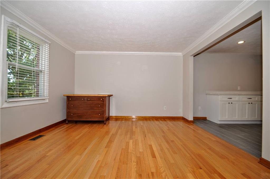 603 Meade Drive Coraopolis, PA 15108 - Photo 19 of 41 a view of an empty room with wooden floor and a window