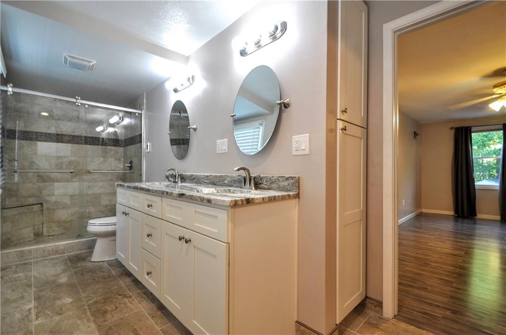 603 Meade Drive Coraopolis, PA 15108 - Photo 24 of 41 a bathroom with a double vanity sink and a mirror