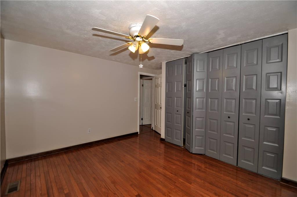 603 Meade Drive Coraopolis, PA 15108 - Photo 29 of 41 a view of an empty room with closet and wooden floor