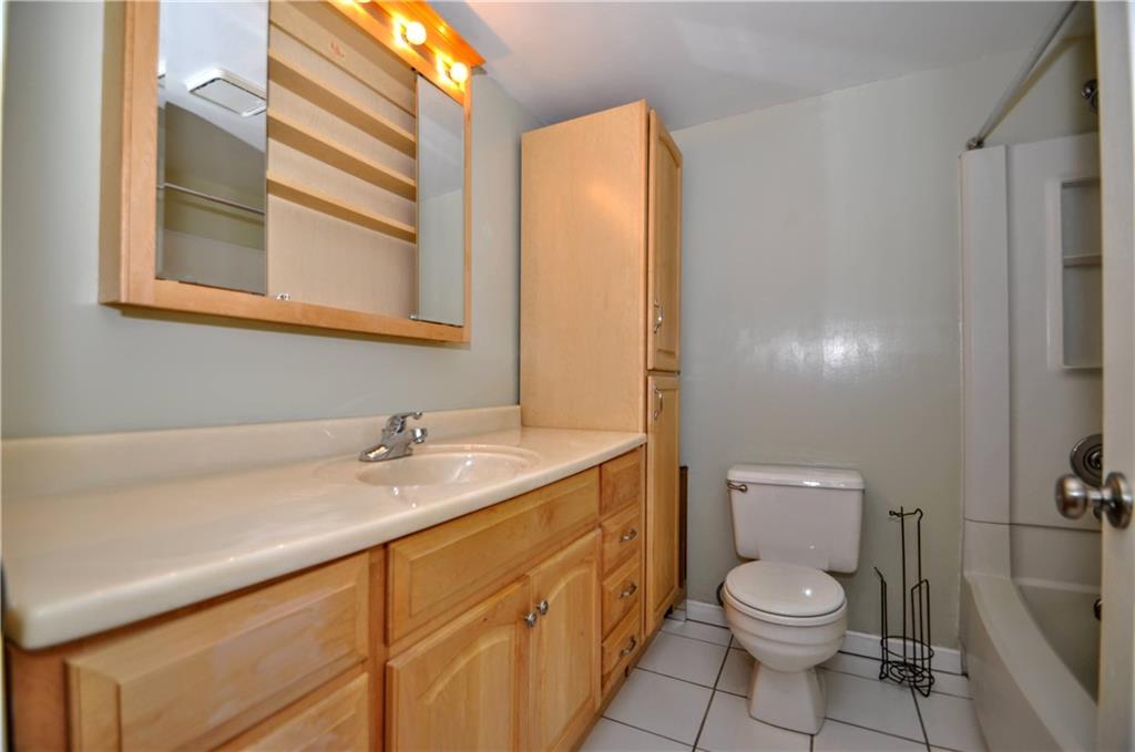 603 Meade Drive Coraopolis, PA 15108 - Photo 30 of 41 a bathroom with a granite countertop toilet sink and mirror