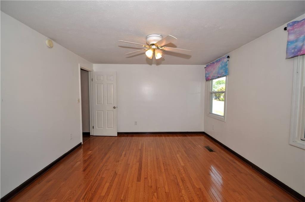 603 Meade Drive Coraopolis, PA 15108 - Photo 31 of 41 a view of empty room with wooden floor and fan