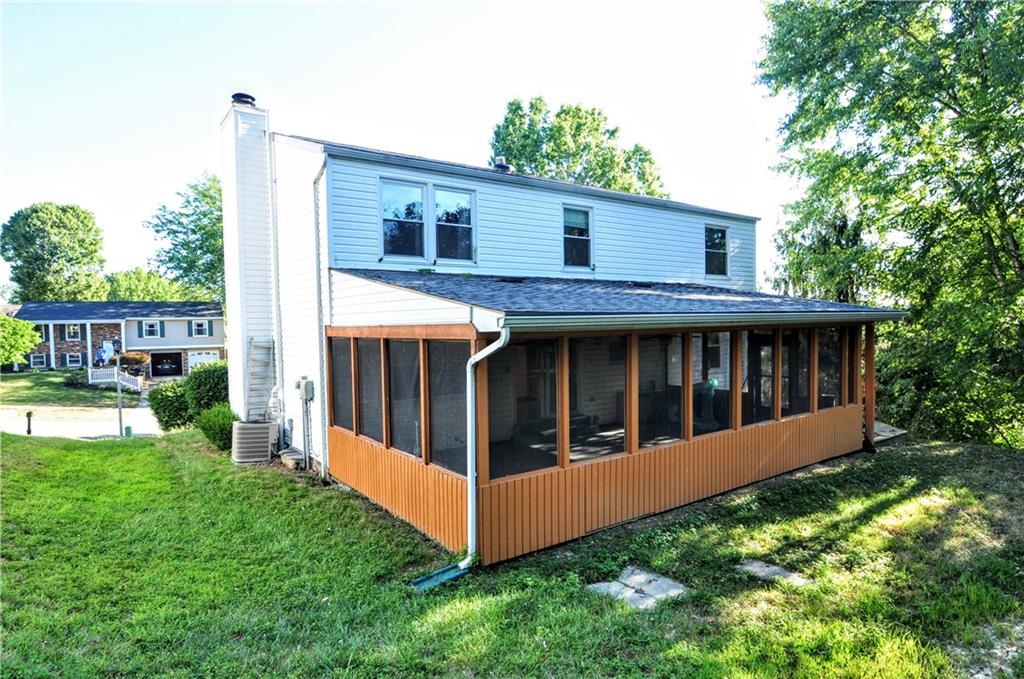 603 Meade Drive Coraopolis, PA 15108 - Photo 35 of 41 a view of a house with backyard and porch with a large tree