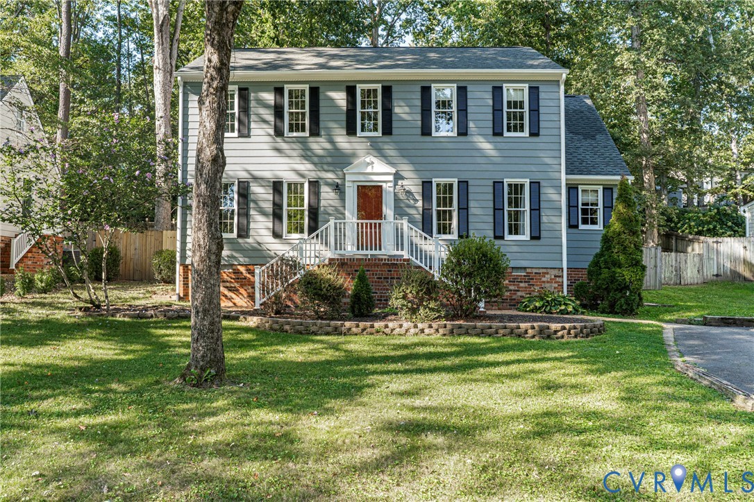 12831 Ashtree Road Midlothian, VA 23114 - Photo 1 of 45 a front view of a house with a yard