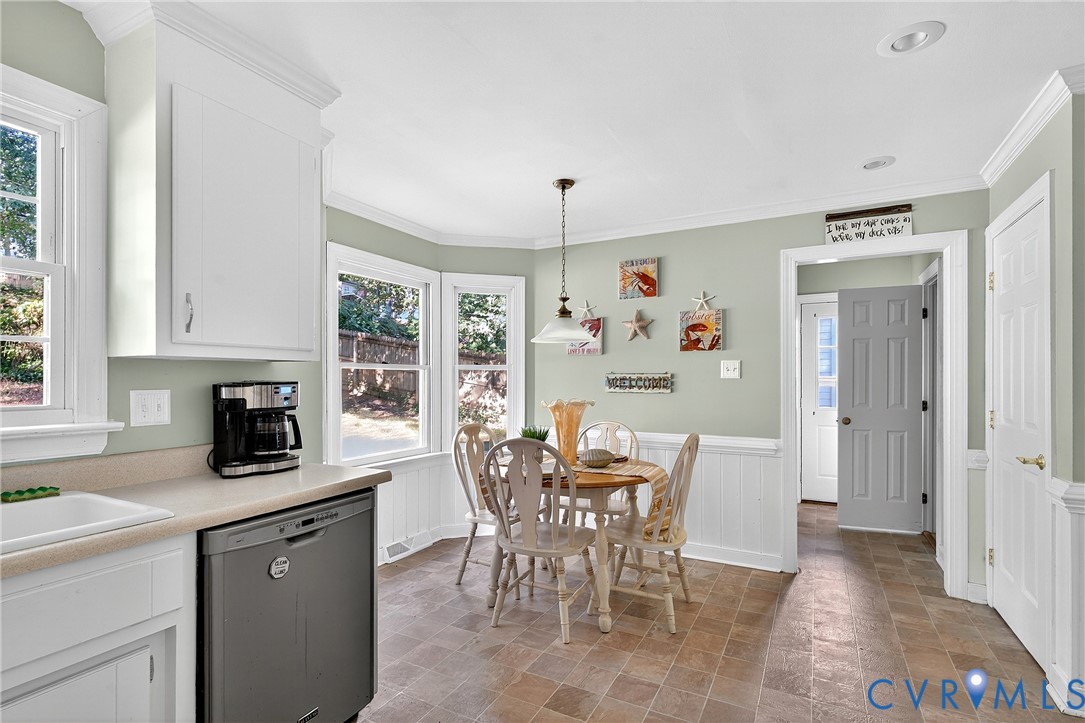 12831 Ashtree Road Midlothian, VA 23114 - Photo 11 of 45 a view of a dining room with furniture window and outside view