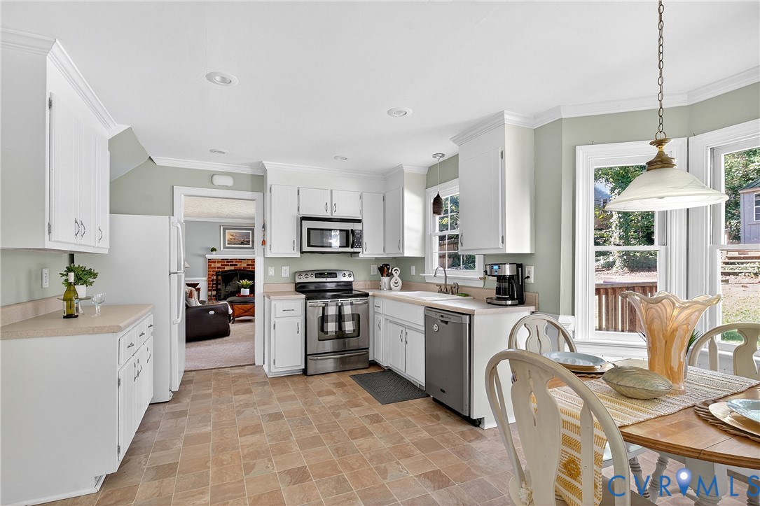 12831 Ashtree Road Midlothian, VA 23114 - Photo 13 of 45 a kitchen with stove a sink and refrigerator