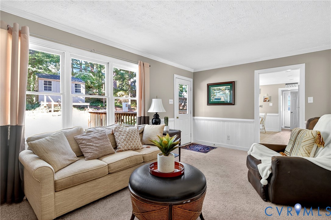 12831 Ashtree Road Midlothian, VA 23114 - Photo 18 of 45 a living room with furniture and a large window