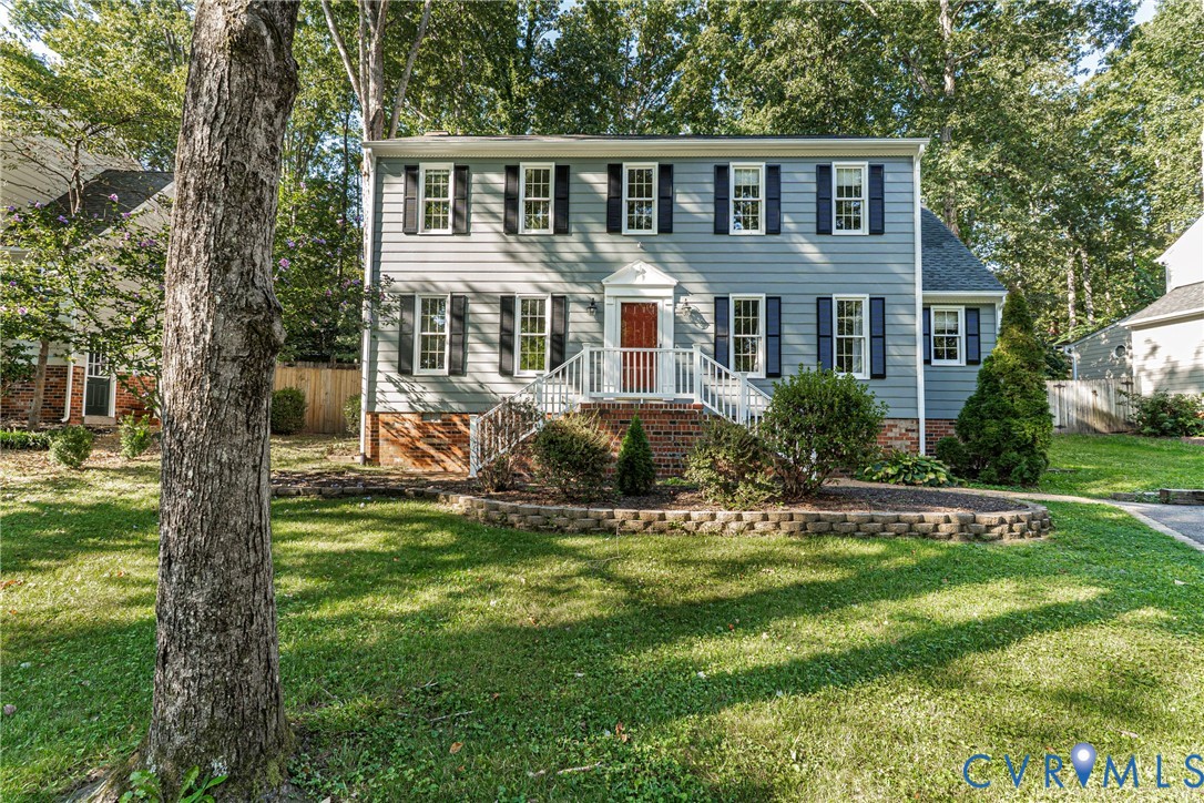 12831 Ashtree Road Midlothian, VA 23114 - Photo 2 of 45 a front view of house with yard and green space