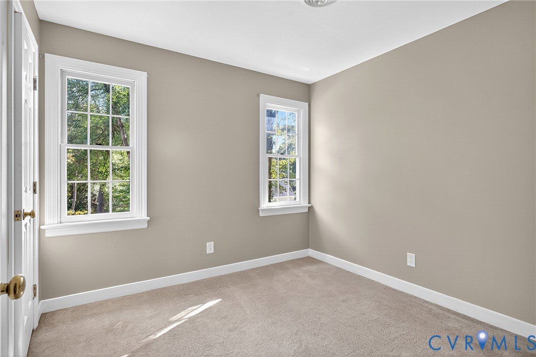 12831 Ashtree Road Midlothian, VA 23114 - Photo 30 of 45 an empty room with windows