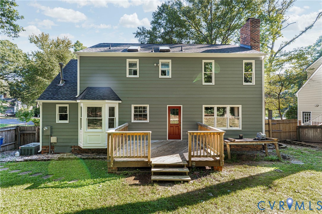 12831 Ashtree Road Midlothian, VA 23114 - Photo 38 of 45 a front view of a house with a yard table and chairs