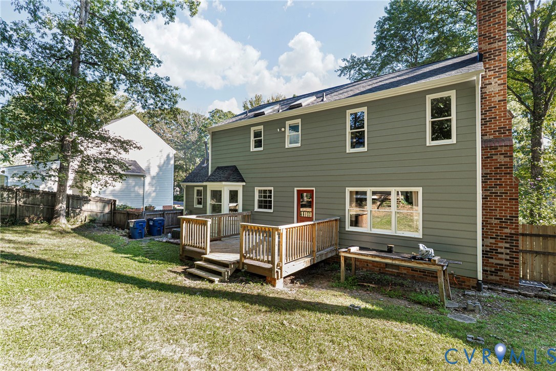 12831 Ashtree Road Midlothian, VA 23114 - Photo 39 of 45 a view of a house with a yard chairs and iron fence