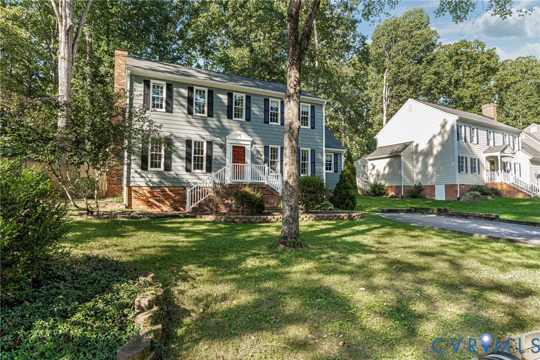 12831 Ashtree Road Midlothian, VA 23114 - Photo 4 of 45 a front view of a house with a yard