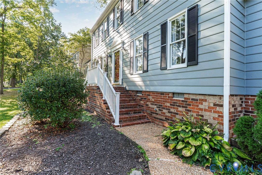 12831 Ashtree Road Midlothian, VA 23114 - Photo 44 of 45 a view of a pathway of a house with backyard and garden