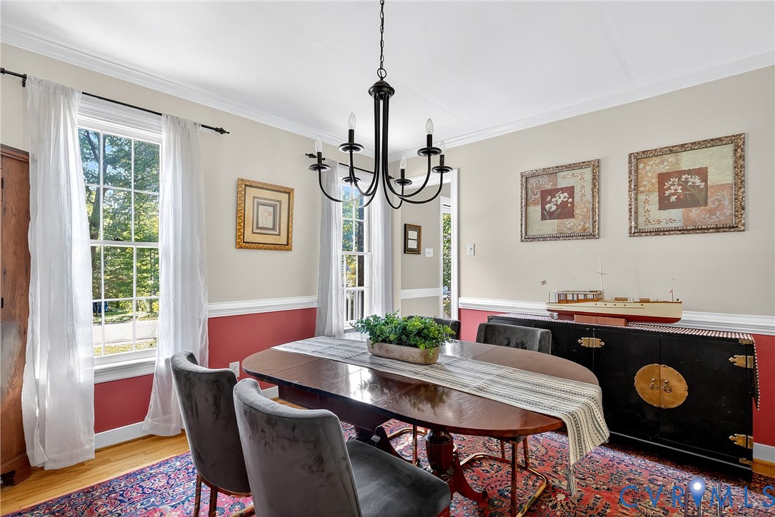 12831 Ashtree Road Midlothian, VA 23114 - Photo 6 of 45 a view of a dining room with furniture window and wooden floor