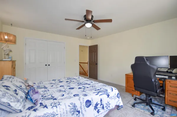 a view of a livingroom with furniture and a flat screen tv