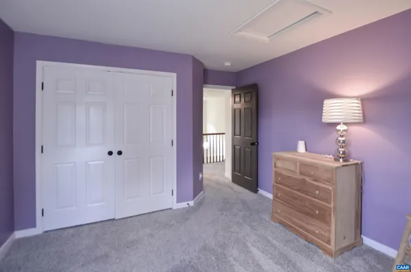 a bathroom with a sink a mirror and a shower curtain
