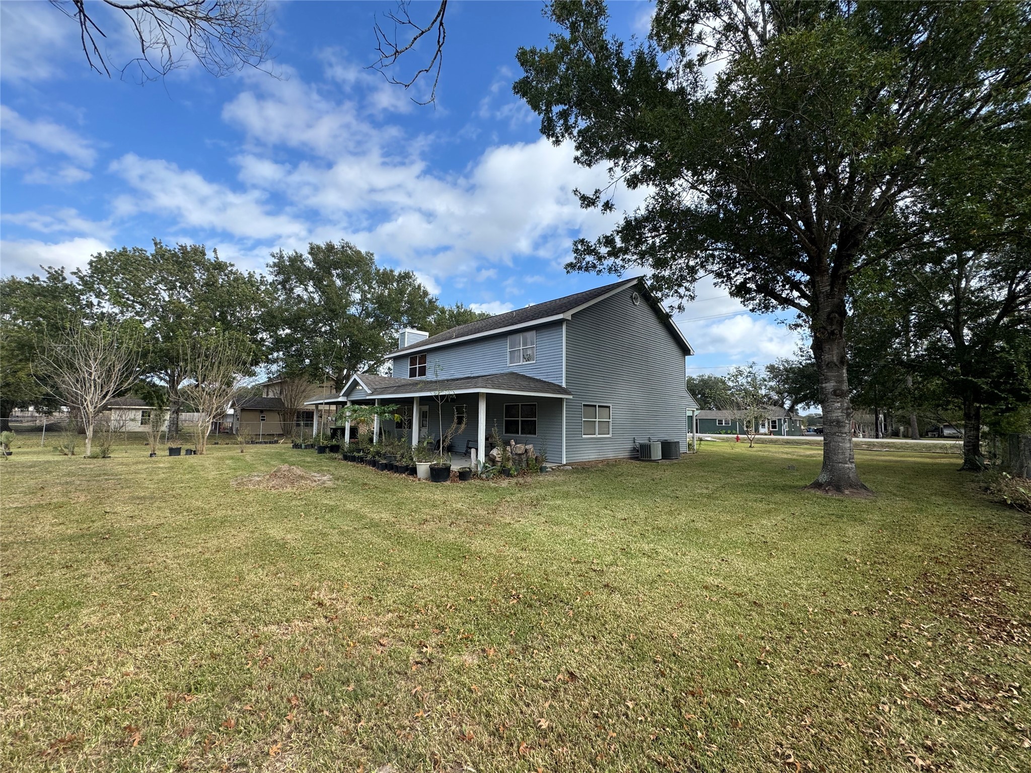 12420 Old Needville Fairchild Road Needville, TX 77461 - Photo 2 of 26 a house with huge green field in front of it