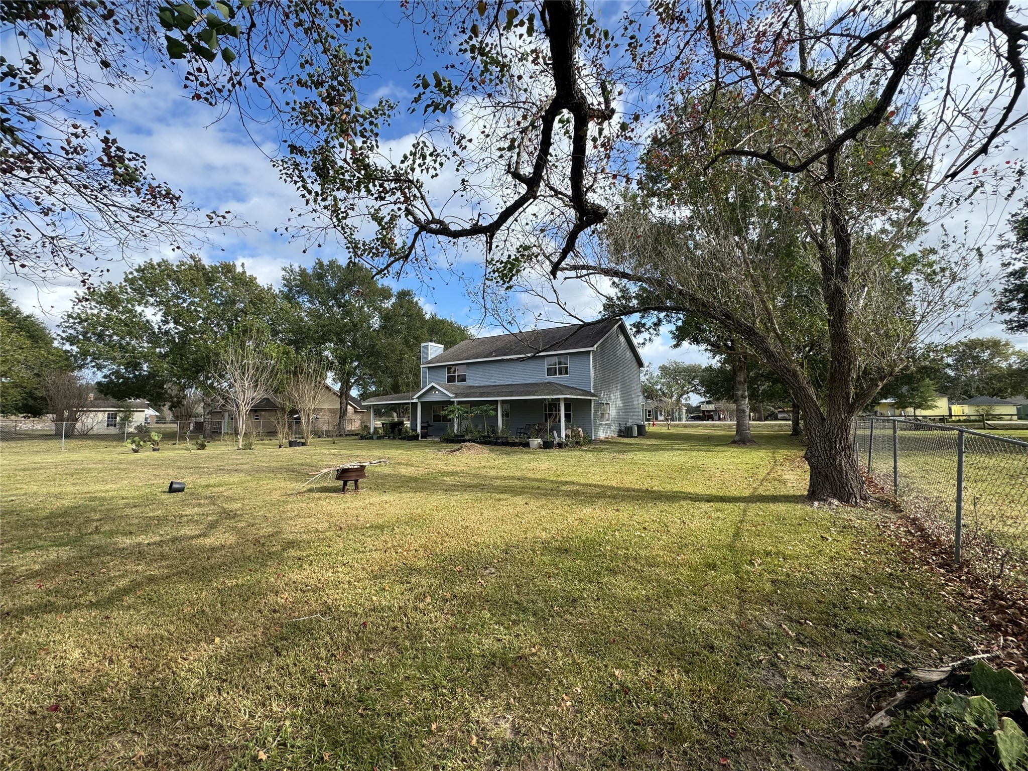 12420 Old Needville Fairchild Road Needville, TX 77461 - Photo 3 of 26 a view of a swimming pool with a big yard and large trees