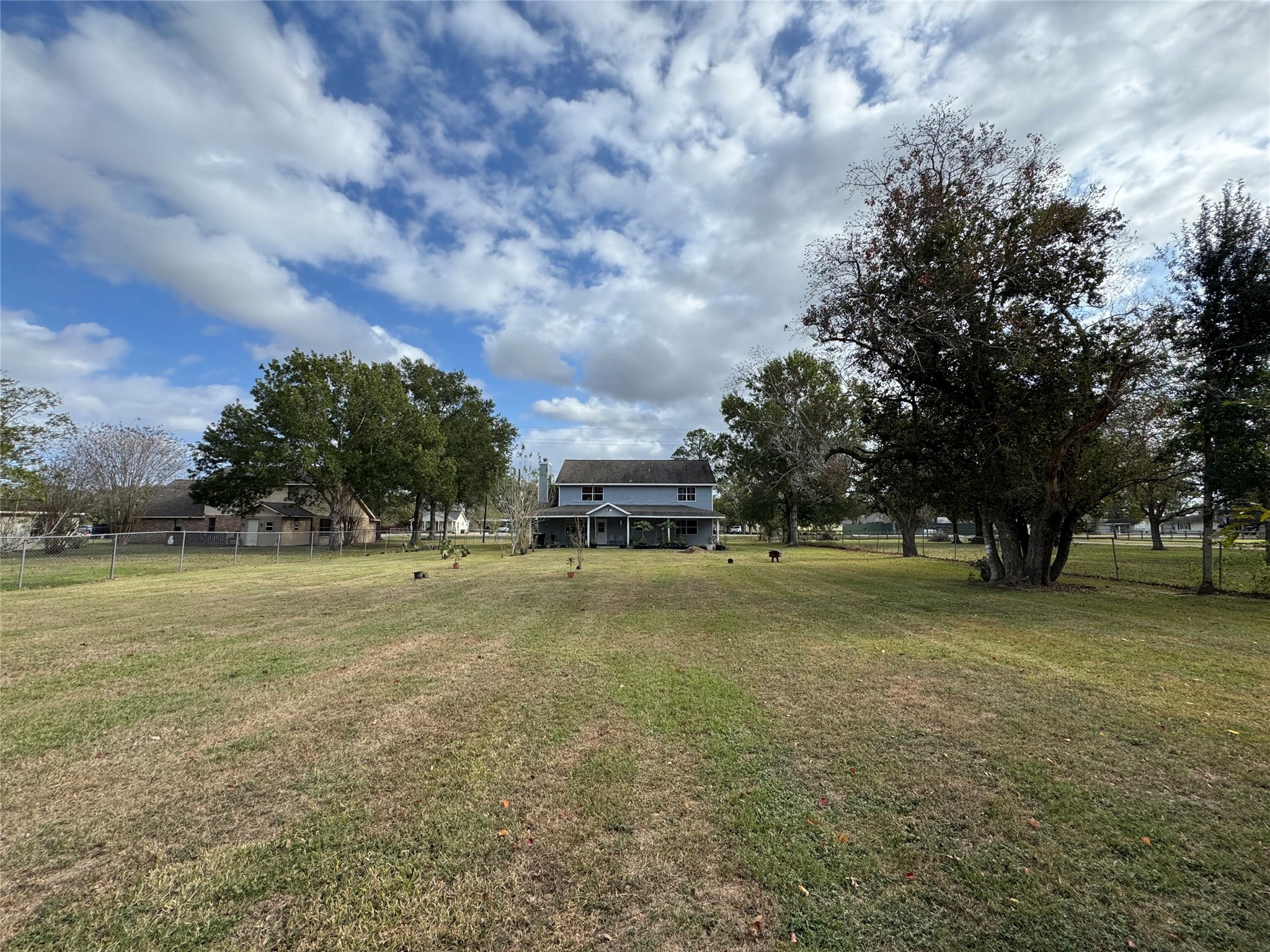12420 Old Needville Fairchild Road Needville, TX 77461 - Photo 5 of 26 a view of a big yard with trees