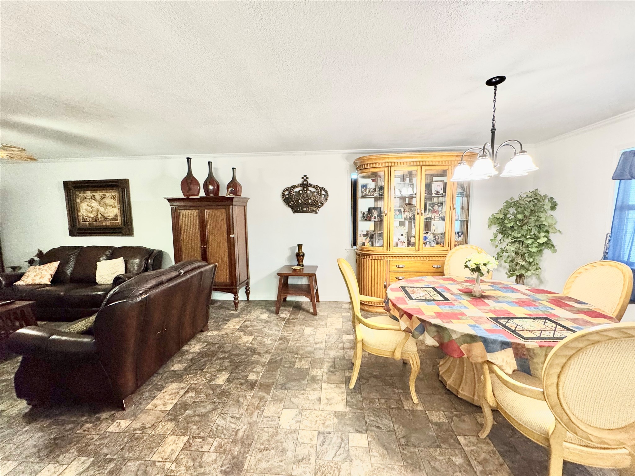 12420 Old Needville Fairchild Road Needville, TX 77461 - Photo 8 of 26 a living room with furniture and a chandelier